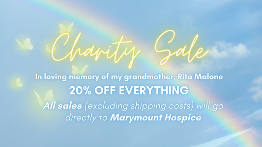 A graphic of a blue sky with a rainbow and yellow butterflies. The text reads: "Charity Sale. In loving memory of my grandmother, Rita Malone. 20% OFF EVERYTHING. All sales (excluding shipping costs) will go directly to Marymount Hospice."