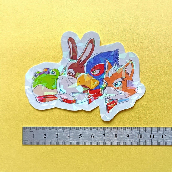 Photo of one of the stickers against a ruler to show it's size.