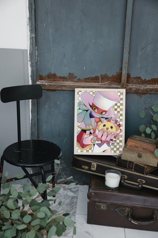 The aforementioned illustration of Balan and Tim displayed in a mock-up frame for real life reference. The frame is placed on top of a few vintage suitcases, and is leanding against a blue, worn-down, wooden wall. A black chair is to the left of it, with some green plants shown in the bottom left corner.