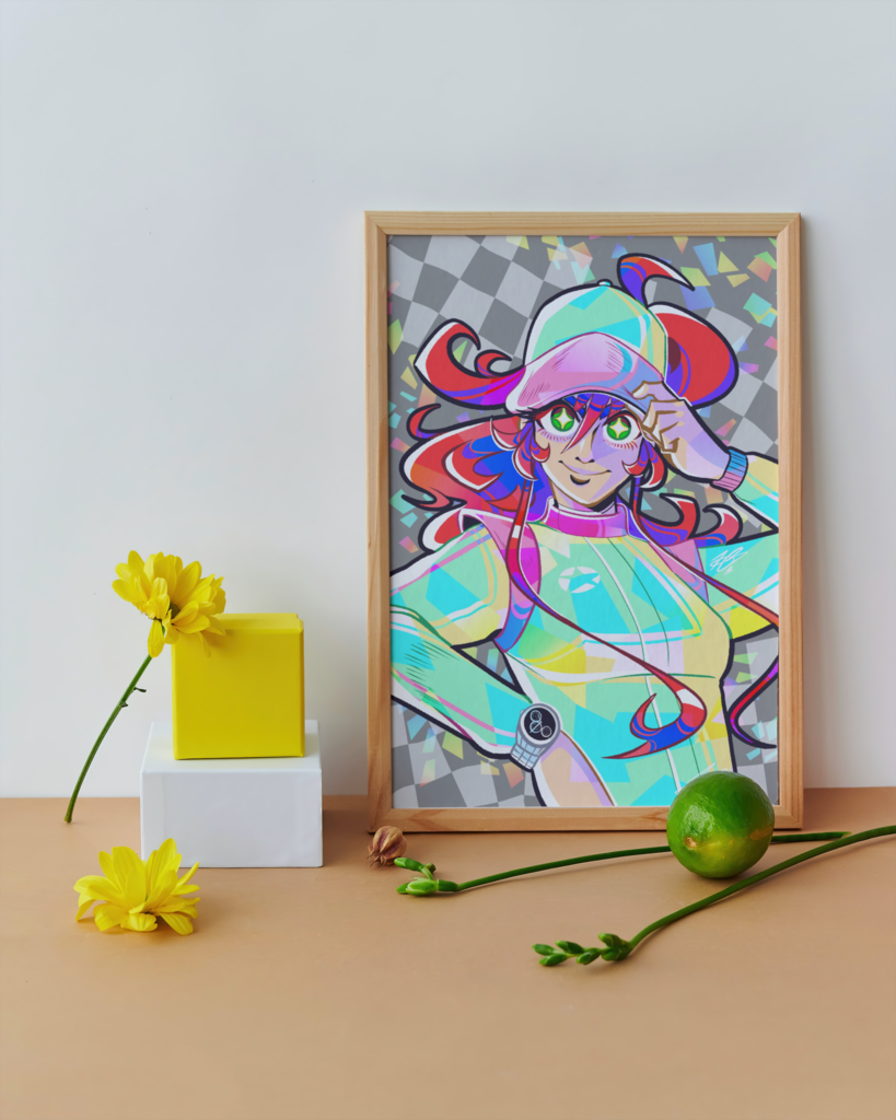 The aforementioned Tiffany illustration shown in a mock-up display frame for real life reference. It's in a wooden frame, leaning against a white wall, placed on top a wooden table. There's a yellow block and a white block stacked on top of each other to the left of it. The table is also decorate with yellow flowers, some other greenery and what appears to be a lime.