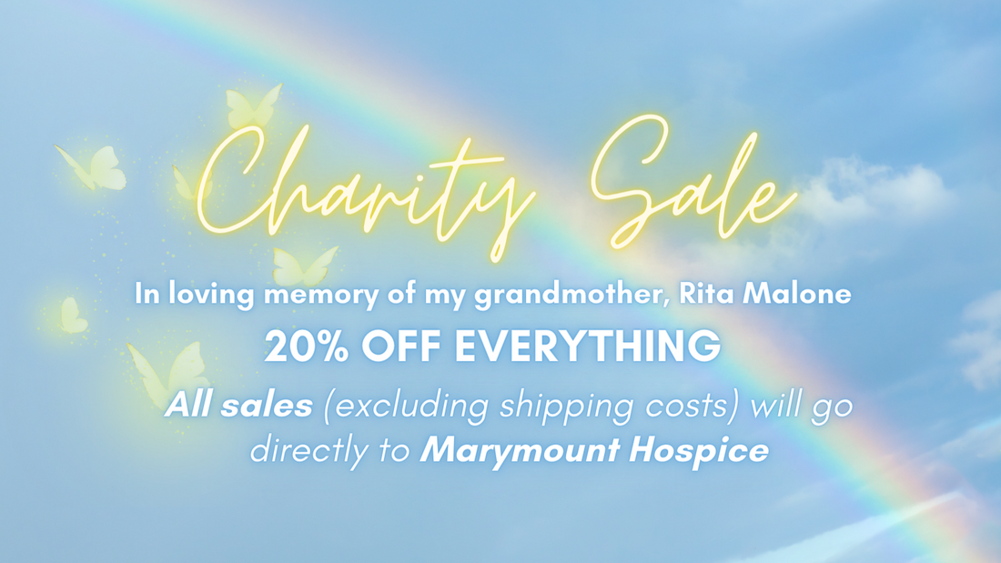 A graphic of a blue sky with a rainbow and yellow butterflies. The text reads: "Charity Sale. In loving memory of my grandmother, Rita Malone. 20% OFF EVERYTHING. All sales (excluding shipping costs) will go directly to Marymount Hospice."