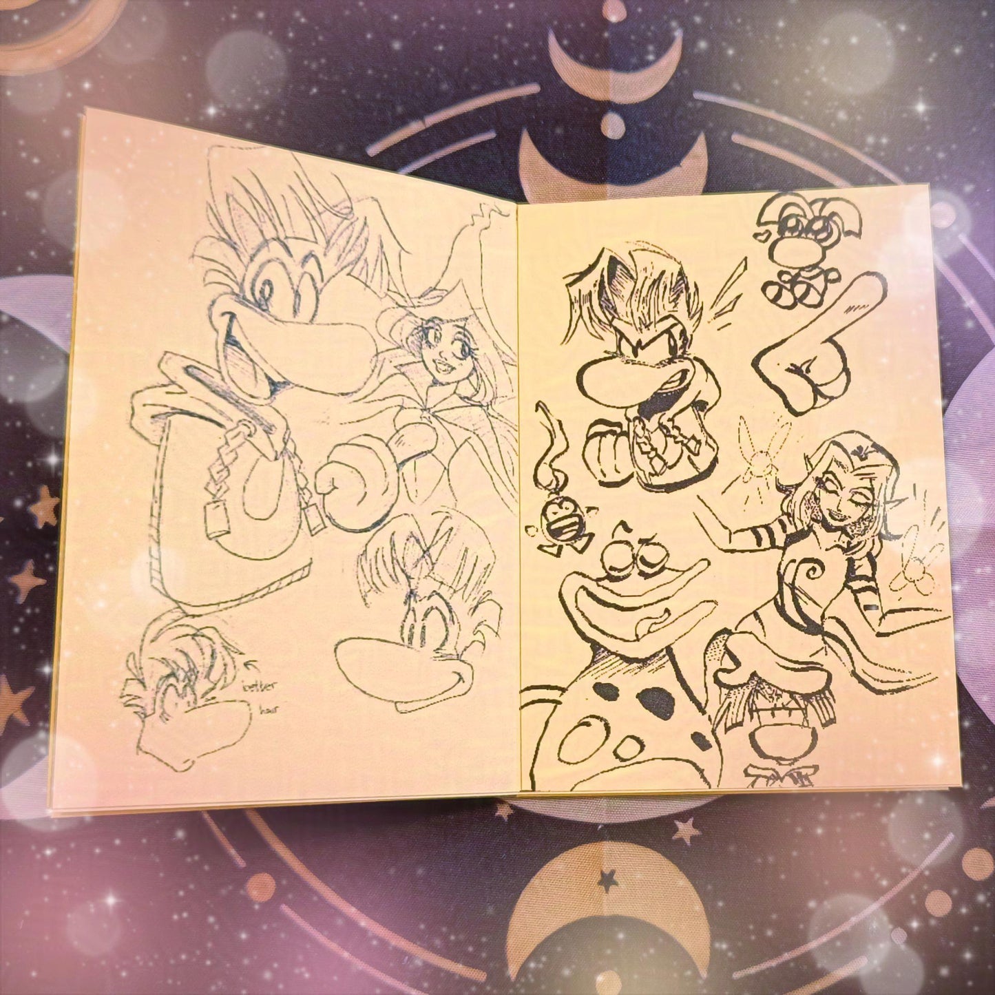 Photo of some inside pages of my Rayman mini 8-page zine that also features Betilla, Ly and Globox.