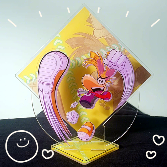 Acrylic standee of Rayman doing a punch and kick attack while smiling with an open mouth triumphantly.