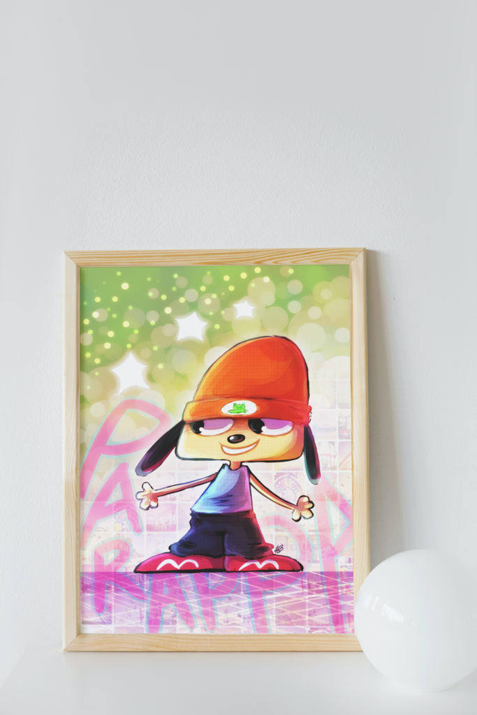 The aformentioned Parappa illustration shown in a mock-up display frame for real life reference. the frame is placed on a white table, leaning against a white wall. A small, white orb is placed to the right of the frame.